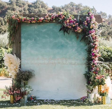 ###DIY Painted CanvasThis [ceremony backdrop](https://www.brides.com/gallery/tropical-ceremony-backdrops-perfect-for-destination-wedding) was a true labor of love: The bride’s father built the frame and her mother hand-painted the hanging canvas (the copy reads and repeats “Found me somebody to love”). Outdoor Ceremony Backdrop, Ceremony Backdrop Outdoor, Mumu Wedding, Painted Backdrops, Yosemite Wedding, Wedding Painting, Party Outdoor, Bad Idea, Theme Color