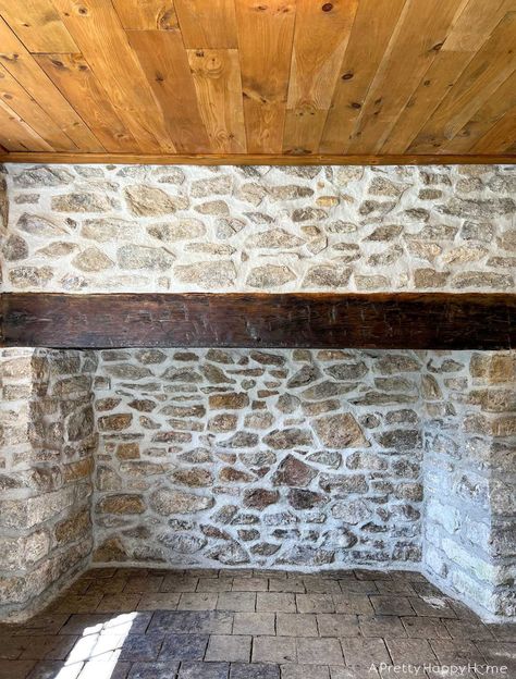 250-year-old stone fireplace makeover using lime mortar to repoint stones.   #stonefireplace #limemortar #oldbuildings #historicconstructiontechniques #historicconstruction #repointing #woodmantel Heavy Mortar Stone Fireplace, White Mortar Stone Fireplace, Mortar Washed Stone Fireplace, Mortar Wash Stone Fireplace, Lime Wash Stone Fireplace, Old Stone Fireplace Makeover, Lime Stone Wall, Painting Stone Fireplace, Overgrouted Stone