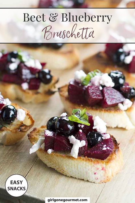 These Roasted Beet and Blueberry Bruschetta is a simple and delicious appetizer recipe! It's as easy as; toasting the bread, tossing together the beets, blueberries, basil balsamic, and olive oil. Pile it all on the toasted bread along with a sprinkling of crumbled feta and a small drizzle of olive oil. Pop over to my site for the recipe! | appetizer recipes | finger foods | snacks | beet recipes | vegetarian recipes | new years eve party ideas | Blueberry Bruschetta, Bruschetta Recipes, Easy Bruschetta Recipe, Easy Bruschetta, Bruschetta Recipe, Beet Recipes, Deli Food, Snacks Für Party, Blood Type