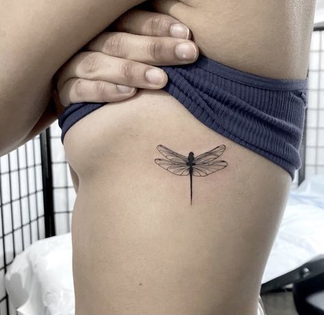 fine line dragonfly tattoo Dragonfly Tattoo Rib Cage, Dragonfly Tattoo Thick Lines, Womens Dragonfly Tattoo, Rib Dragonfly Tattoo, Fine Line Tattoos Dragonfly, Dainty Dragonfly Tattoo For Women, Dragfly Tattoo, Dragonfly Tattoo On Ribs, Dragon Fly Rib Tattoo