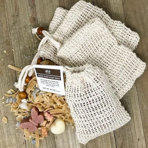 Easy Knitted Soap Sack - a FREE Pattern | Alō Goods Soap Scraps, Soap Sack, Handmade Lavender Soap, Soap Suds, Knitted Washcloth Patterns, Knitted Washcloths, Soap Bag, Washcloth Pattern, Scrap Busters