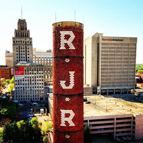 Aerial photo: RJR Smokestack Between New and Old Reynolds American Headquarters Buildings. Winston-Salem, NC. #WinstonSalem #WingsOverWinston Reynolda House, Piedmont Airlines, Winston Salem North Carolina, Winston Salem Nc, North Carolina Homes, Winston Salem, Arts District, Aerial Photo, Creativity And Innovation