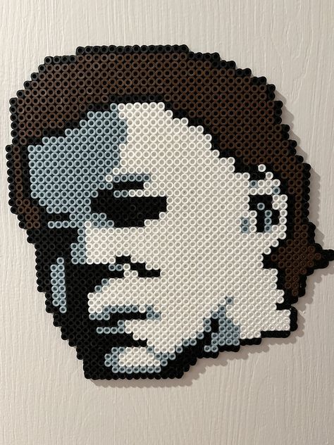 This is a handmade Micheal Myers design made of perler beads. This can be framed or displayed as is. Very lightweight and easy to display in any horror collection, display, or setting. Perfect for any and all horror fans. Gorilla Tag Perler Beads, Haunted Mansion Perler Beads, Micheal Myers Pixel Art, Wwe Perler Beads, Michael Myers Coloring Pages, Michael Myers Perler Beads, Pearler Bead Halloween, Coraline Perler, Horror Perler Bead Patterns