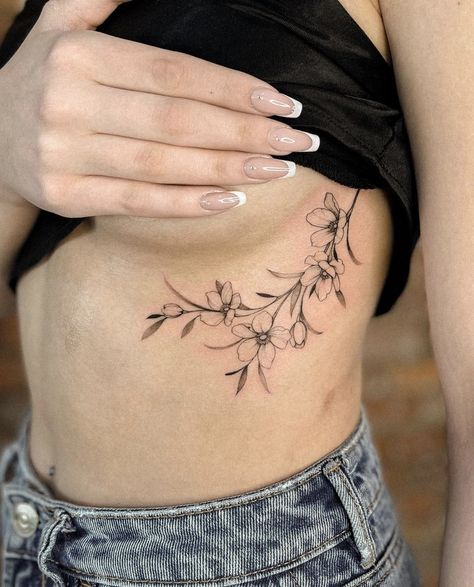 Floral Tattoo Design Side Rib, Vine Tattoos Ribcage, Side Floral Tattoo, Rib Floral Tattoos For Women, Rib Cage Floral Tattoo, Cherry Blossom Tattoo Rib Cage, Floral Ribcage Tattoos For Women, Floral Tattoo Ribcage, Magnolia Tattoo Ribs