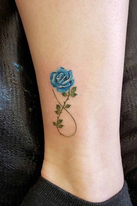 Flower Tattoos On Ankle, Tattoos On Ankle, Blue Rose Tattoo Meaning, Flower Ankle Tattoos, Flower Ankle Tattoo, Ankle Tattoo Ideas, Rose And Butterfly Tattoo, Rose Tattoos For Women, Blue Rose Tattoos