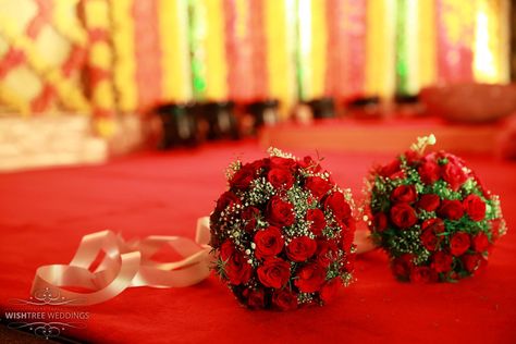 Wedding Bouquets- An exclusive South Indian hindu wedding designed and managed by Wishtree Weddings. Wedding Bouquets Indian Bride, Hindu Wedding Bouquet, Indian Hindu Wedding, Aquarium Architecture, Rose Petals Wedding, Bridal Bun, Wedding Bouquets Bride, Stage Decoration, Wedding Highlights