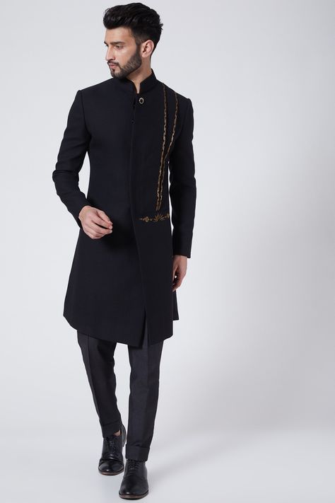 Featuring a black achkan jacket in wool crepe base with shoulder pleats and dabka embroidery. It is paired with matching trousers.    FIT: True to size.  COMPOSITION: Wool crepe.  CARE: Dry clean only. Jatin Malik Couture, Achkan For Men, Jatin Malik, Indo Western Dress For Men, Dabka Embroidery, Indo Western Dress, Wool Crepe, Designer Suits For Men, Western Jacket