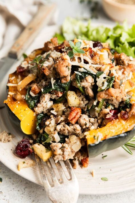 This Sausage Stuffed Acorn Squash recipe is exactly what we crave when the air gets crisp and squash is in season. It’s made with roasted acorn squash halves, ground pork, vegetables, fresh herbs, dried cranberries, chopped pecans, and shredded Parmesan to encapsulate the flavors of the autumn season. Sausage Stuffed Acorn Squash, Acorn Squash Recipe, Edible Bowl, Easy High Protein Meals, Roasted Acorn Squash, Stuffed Acorn Squash, Acorn Squash Recipes, Baked Squash, Squash Recipe