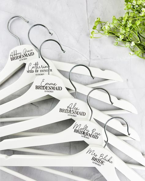 Your wedding day is a once in a lifetime moment and we have the perfect touch to make it even more unforgettable. These are our dreamy white coated timber coat hangers. They are a beautiful photography prop but they also make a thoughtful keepsake for your bridal party so everyone can cherish your special day for years to come. They are really easy to personalise and order and with next business day dispatch there is no stress - all the hard work is done for you. Explore our personalised wedd... Unique Bridal Party Gifts, Wedding Coat Hangers, Best Groomsmen Gifts, Couple Gifts For Her, Personalized Hangers, Wedding Tumblers, Car Lover Gifts, Personalized Wedding Decor, Wedding Coat