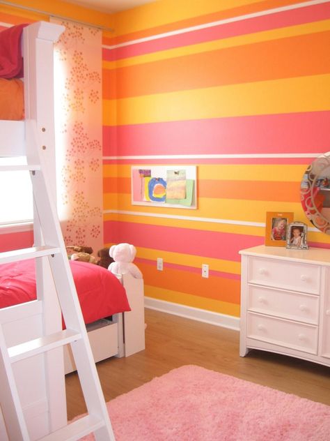 HGTV fan Andi2347 combined bold stripes in orange, pink, yellow and white to create the ultimate girls’ bedroom for two. The sweet color combination helps reflect the natural light, creating a playful yet sophisticated space. Striped Bedroom, Orange Room, Wall Layout, Color Palette Living Room, Girls Room Design, Orange Rooms, Orange Bedroom, Bedroom Pink, Colorful Kids Room