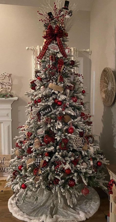 Red And White Rustic Christmas Tree, Red And Green Flocked Tree, Christmas Three Color Ideas, White Red And Silver Christmas Tree, Flocked Christmas Tree With Red Decor, Rustic Decorated Christmas Trees, Flocked Christmas Trees Decorated 2023, Red And Gold Flocked Christmas Tree, Christmas Tree Red And Gold Ideas