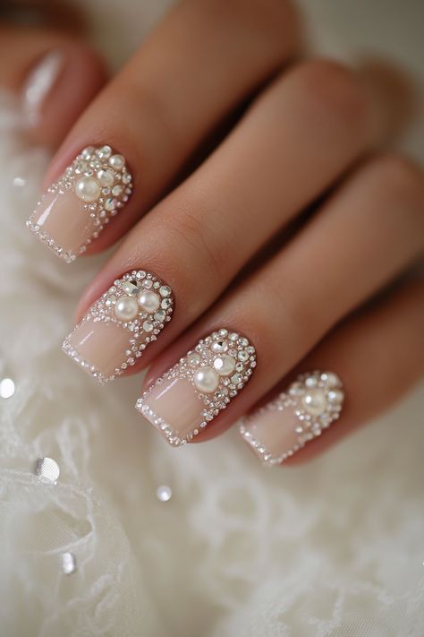 Wedding day manicure. Pearl accents on soft pink base, clear crystal tips.

First impressions last a lifetime - and that’s why every detail matters on your big day, especially when it comes to your nails. Presenting 39 mix of timeless classics and trendy bridal wedding nail art designs that promise to make your ring exchange even more photogenic. Whether you're all about…

Read more: https://tastywed.com/generated-post-39-creative-bridal-wedding-nail-art-designs-and-tips/ Best Wedding Nails Brides, Bridal Nails Short, Nails With Pearls On Them, Cathedral Wedding Ceremony, Wedding Nail Art Designs, Bride Nail, Watercolor Wedding Cake, Crystal Tips, Wedding Ceremony Setup