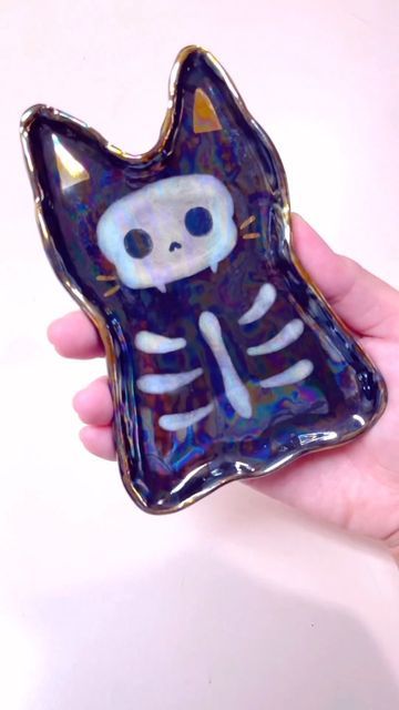 Tham Nguyen on Instagram: "Here is my full version of the Halloween skeleton cat 🐈‍⬛ trinket dish. I didn’t realize I have most steps recorded. I’m so glad I am able to share a video from start to finish. It’s hard to set up a good angle while making ceramic because clay and glaze tend to be messy. #ceramicart #halloween2023 #handbuiltceramics #trinketdish #ghostart" Cat Trinket Dish, Cat Trinket, Skeleton Cat, Trinket Holder, Cat Dishes, Halloween Skeleton, Clay Ideas, Trinket Tray, Crazy Cat