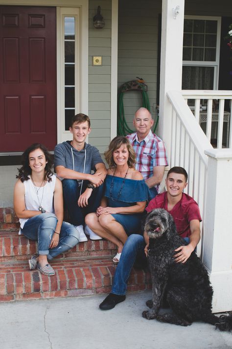 Front Porch Family Photos / Jordan Edens Photography / Tri-Cities Washington Photographer / Family Pose / Family Portrait / Family photos with the puppy / At home family photos Family Photos With House In Background, Front Porch Portraits, Family House Pictures, Front Porch Family Pictures Photo Ideas, Family Photo Fireplace, Family Photo In Front Of House, Front Porch Family Photoshoot, Front Porch Photography, Porch Family Photoshoot