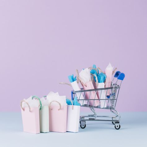 Miniature cart filled with paper shopping bags in front of pink background Free Photo Logo Online Shop, Boutique Logo Design, Phones For Sale, Online Shop Design, Ecommerce Website Design, Boutique Logo, Leather Box, Web Banner, Shopping Bags