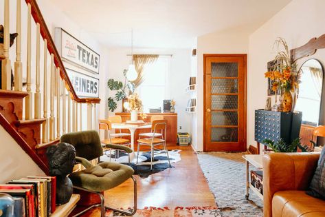 White tulip table is seen in view of dining area from living room. Rowhome Interior Design, Rowhome Living Room, Row Home Interior Design, Philly Rowhome, Kallax Shelving, Row Home, Kallax Shelving Unit, Cube Storage Shelves, Ikea Shelves