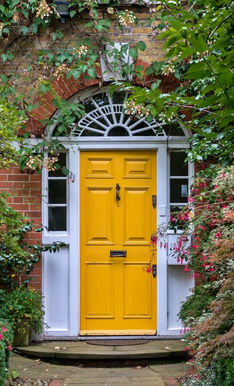 Embrace Sunshine Vibes with a Vibrant Yellow Front Door Yellow Door Aesthetic, Yellow Entrance Door, Yellow Door House Exterior, White House With Yellow Door, Yellow Front Door Red Brick House, Yellow Front Door White House, Yellow Door Exterior, Mustard Yellow Front Door, Colorful Front Door Ideas