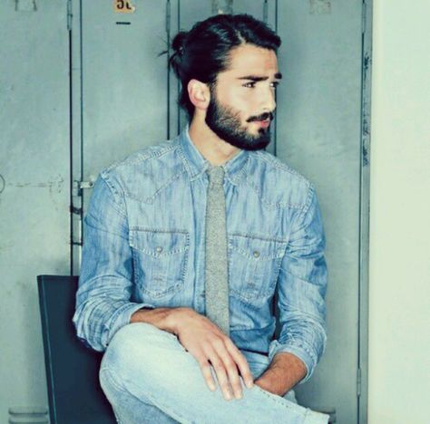 Long Devran Taskesen, Curly Man, Man Bun Hairstyles, Man With A Beard, Blue Denim Shirt, Man Bun, Black Suede Boots, Light Blue Jeans, Hair And Beard Styles