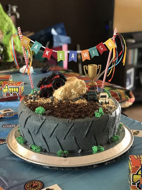 Monster truck and hot wheels themed cake Monster Truck Cake Ideas, Monster Truck Cupcake Cake, Monster Truck Cakes For Boys, 4 Monster Truck Cake, Monster Jam Birthday Cake Ideas, Monster Truck Sheet Cake, Monster Truck Tire Cake, Monster Jam Birthday Cake, Hotwheels Monster Truck Birthday Cake