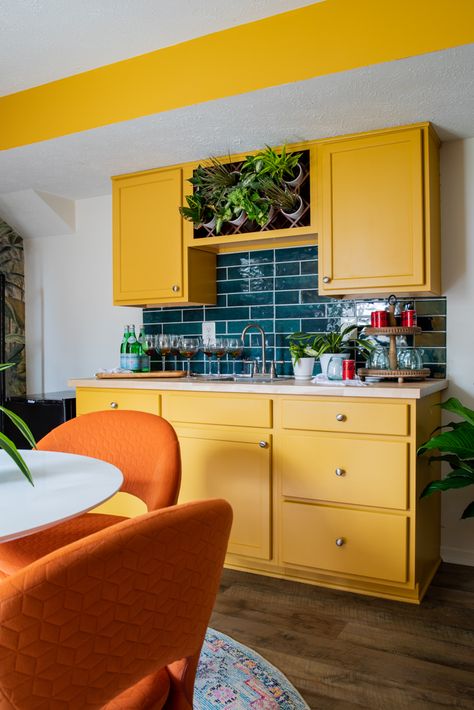 Vintage Green Kitchen Cabinets, Basement Bar Makeover, Orange Kitchen Cabinets, Red Orange Yellow Kitchen, Yellow Kitchen Backsplash Tile, Orange And Green Retro Kitchen, Colorful Basement, Kitchen Yellow Tiles, Yellowkitchen Cabinets