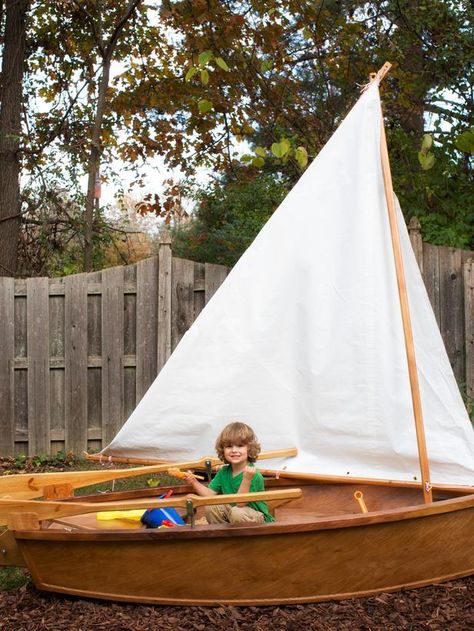 Inspire your little pirate's imagination and add nautical flair to your backyard with a one-of-a-kind sandbox made from a wooden rowboat--> http://www.hgtv.com/decks-patios-porches-and-pools/how-to-make-a-rowboat-sandbox/index.html?soc=pinterest Boat Sandbox, Backyard Sandbox, Outdoor Play Structures, Make A Boat, Backyard Area, Row Boat, Backyard Fun, Sandbox, Outdoor Kids