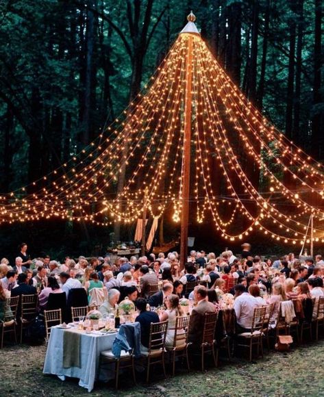 Canopies of string lights at weddings are taking over Instagram by storm and it's no wonder why it's such a beloved lighting style. We're so inspired by this wedding lighting trend that we're convinced everyone should have one of these installations in their patios this summer. #twinklelightsdecor #fairylightsdecor #weddinglighting