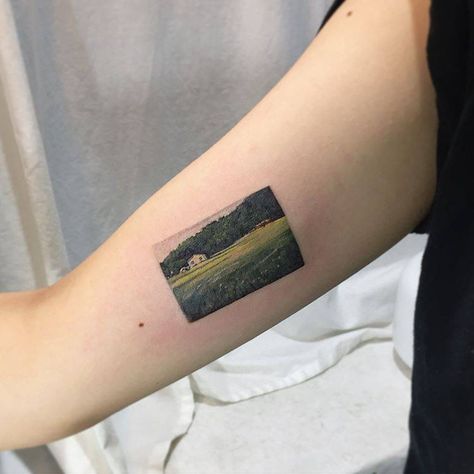 Painting-like countryside landscape tattoo by Muha Lee Bobby Pin Tattoo, Teacher Tattoos, Lotr Tattoo, Green Tattoos, Super Tattoo, Handpoke Tattoo, Landscape Tattoo, Geniale Tattoos, Countryside Landscape