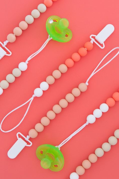 DIY Silicone Pacifier Clips - Sarah Hearts Diy Pacifier Clip, Bead Pacifier Clip, Pacifier Diy, How To Make Silicone, Pacifier Clips Diy, Silicone Teething Beads, Beaded Pacifier Clip, Baby Pacifier Holder, Teething Beads