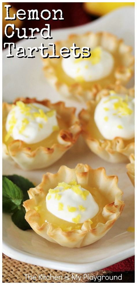 Easy Lemon Curd Tartlets ~ Tart, tangy, and delicious, these little lemony bites are super easy to prepare. Don't be fooled by their little size though -- these tiny tarts pack a huge lemon punch! Perfect for parties and dessert bars.  www.thekitchenismyplayground.com Little Lemonies, Lemon Curd Tarts Mini Easy, Easy Lemon Tarts, Mini Lemon Curd Tarts, Lemon Tarts Recipe, Lemon Tarts Mini Easy, Uses For Lemon Curd, Tiny Desserts Bite Size, Lemon Curd Recipe Easy Desserts