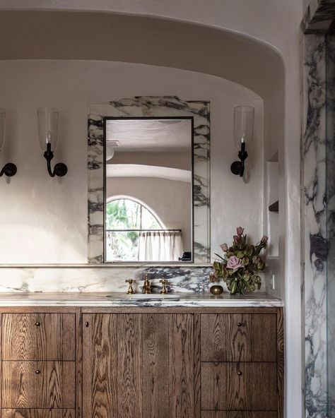 Jake Arnold on Instagram: “Primary bath in recent project. The stained oak cabinets and Monet stone combo feels timeless and warm. For additional storage we…” Jake Arnold, Marble Mirror, Style Tiles, Recessed Medicine Cabinet, Spanish Villa, Marble Frame, Bathroom Design Inspiration, Gorgeous Bathroom, Interior Work