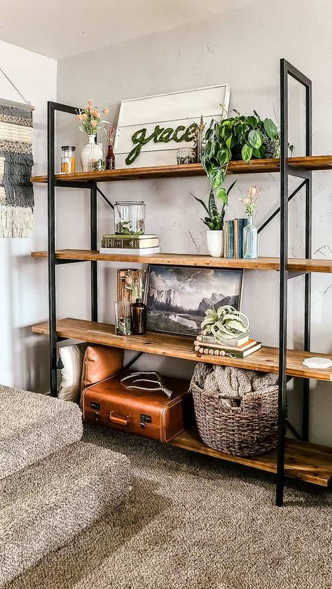 Are you looking for inspiration for your spring living room decor?? See how we styled our shelves with moss vases and vintage books for a boho look. Shelving For Living Room, Bohemian Style Living Room Vintage, Dark Wood Shelves Living Room, Vintage Shelves Decor, Living Room Decor Vintage Modern, Boho Shelf Decor Living Room, Boho Living Room Inspiration Vintage, Boho Living Room Shelves, Diy Living Room Shelves