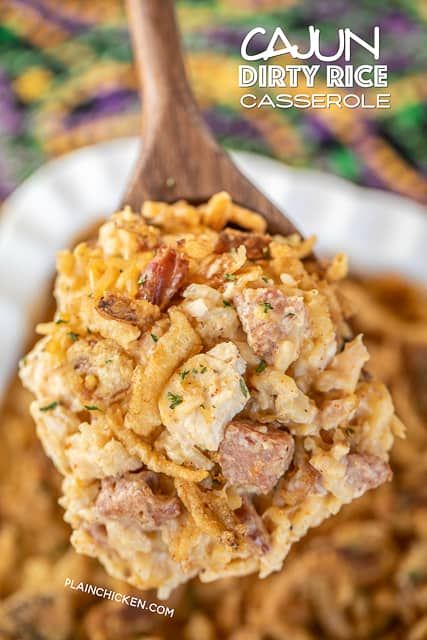 Cajun Dirty Rice Casserole - dirty rice loaded with chicken, smoked sausage, and parmesan cheese. SO good and SUPER easy to make! Zatarain's Dirty Rice, sour cream, cream of chicken soup, parmesan cheese, cooked chicken, smoked sausage, and french fried onions. Can make in advance and refrigerate or freeze for later. A great dish for your Mardi Gras parties! #cajun #mardigras #casserole #rice #freezermeal #chicken #smokedsausage Cajun Dirty Rice, Sausage Recipes For Dinner, Hearty Vegetable Soup, Main Dish Casseroles, Rice Casserole Recipes, Easy Main Dishes, Dirty Rice, French Fried Onions, Cajun Cooking