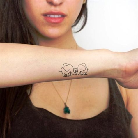 An Elephant Tattoo design is generally considered a symbol of good luck. In fact, elephants are often collected by people – like pigs and frogs – because in many Baby Elephant Tattoo, Tiny Elephant Tattoo, Twin Tattoos, Phönix Tattoo, Elephant Tattoo Design, Hawaiian Tattoo, Initial Tattoo, Daughter Tattoos, Small Wrist Tattoos