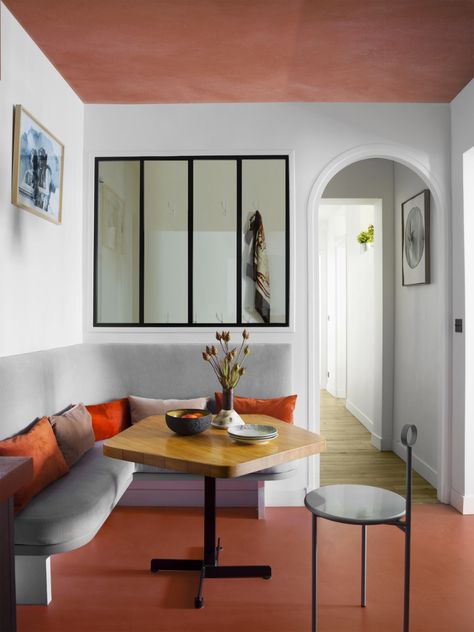 Sophie Dries renovates Paris apartment from the Haussmann era Paris Marais, Modern Parisian Apartment, Modern Parisian, Kitchen Banquette, Banquette Seating, Charlotte Perriand, Parisian Apartment, Colour Blocking, Paris Apartments