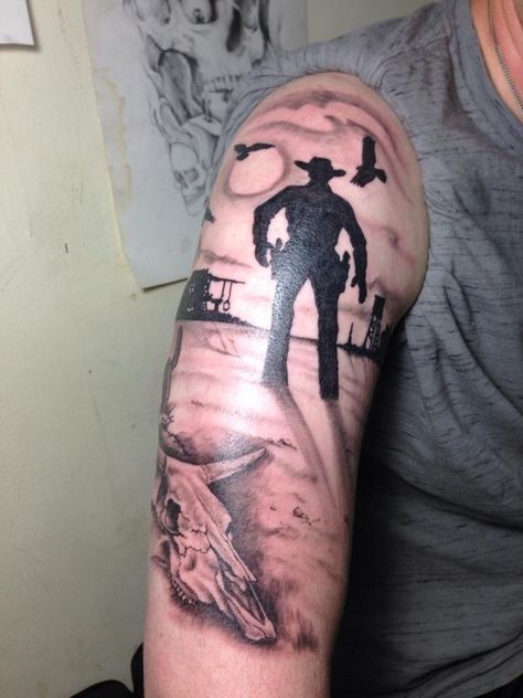 Old western scene. My buddy Jake's tattoo. Bicep tat. Old West Tattoo, Western Tattoo Ideas, Thigh Sleeve Tattoo, West Tattoo, Tattoo Bicep, Western Tattoo, Tattoo Sleeve Filler, Old Western, Elements Tattoo