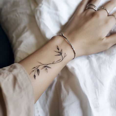 50 Super Cute Wrist Tattoos For Women You’ll Want ASAP Tattoos Wrapped Around Wrist, Vine Wrist Tattoos For Women, Top Wrist Tattoos For Women, Wrist Writing Tattoo, Wrist Floral Tattoo, Delicate Wrist Tattoos For Women, Pretty Wrist Tattoos, Cute Wrist Tattoos For Women, Delicate Bracelet Tattoo