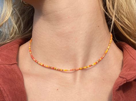 Perfect fall pieceIncludes different shades of yellow and orange creating a nice neutral necklaceGreat for layering Beaded Yellow Necklace, Yellow Necklace Bead, Orange Necklace Beads, Fall Necklaces Diy, Yellow Glass Bead Bracelet, Yellow Seed Bead Necklace, Orange Beaded Jewelry, Autumn Necklace Fall Jewelry, Fall Beaded Necklaces