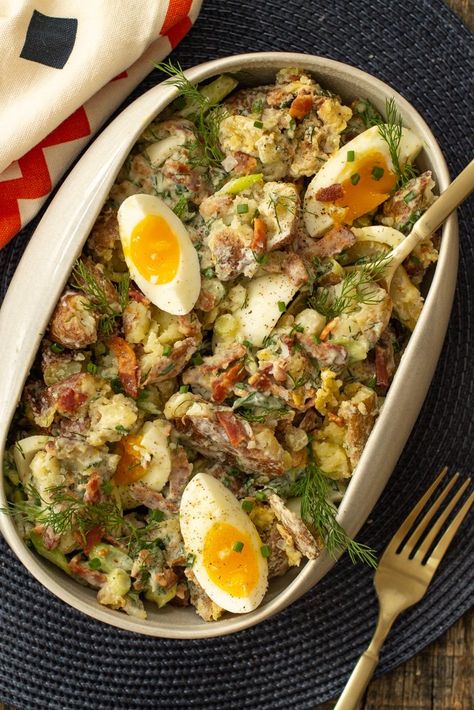 Crispy-edged potatoes are combined with buttermilk dressing, green onions, dill, and chives. Jammy eggs and bacon bits add a rich finish. Super Bowl Side Dishes, Super Bowl Sides, Smashed Potato Salad Recipe, Smashed Potato Salad, Jammy Eggs, Salad Potato, Burger Side Dishes, Smashed Potatoes Recipe, Unique Salad