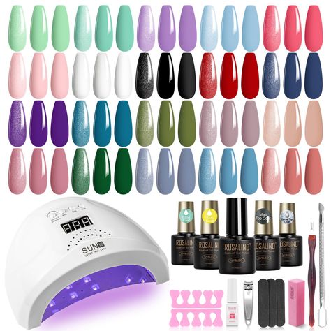 PRICES MAY VARY. The Gel Nail Kit You Will Get: 32 pcs gel polish kit includes 20 bottles of multi-color gel nail polish, 4 bottles of base coat, glossy coat, matte top coat, glitter top coat. And a lightweight 48W nail lamp and manicure tools. Powerful Nail Gel Polish Lamp: Ultra-fast drying UV light gel nail polish dryer with 3 timer settings of 30/60/120 seconds. Display can show the time of use; auto-sensing function, just put your hand in, the light will automatically light up, let go of yo Nail Art Glamour, Home Gel Nail Kit, Nail Polish Dryer, At Home Manicure, Home Manicure, Pedicure Nail Designs, Uv Nail Lamp, Nail Polish Kit, Manicure Diy