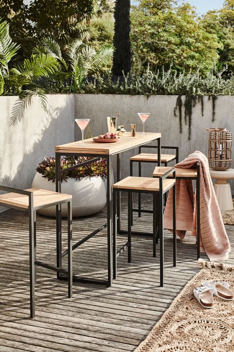 Perfect for patios and smaller decks, the Windsor 5 piece balcony set includes 4 bar stools and a folding table design to expand or contract the tabletop to accommodate friends. Crafted from teak timber over a powder-coated galvanised steel frame, this bar table set is ideal for outdoor living, whether enjoying poolside cocktails or takeaway on the balcony. Outdoor bar table set Includes fold-out table and 4 seats Natural teak top and black steel frame High Chair And Table For Balcony, Balcony High Table, Bar Table Outdoor Patio, Bar Table Balcony, Outdoor High Top Table, Outdoor High Table, Balcony Dining Table, Bar Table Outdoor, Balcony Bar Table