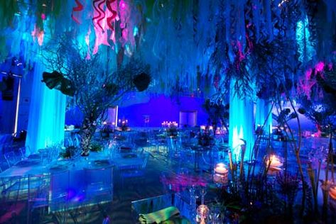 By  hanging flowers from the ceiling of the venue you will create the effect of sea kelp and with colorful blue lighting you can achieve your under the sea theme in a tasteful manner. Prom Themes, Underwater Theme, Sea Wedding, Winter Wonderland Theme, Prom Decor, Special Events Decor, Wedding Social, Prom Theme, Under The Sea Theme