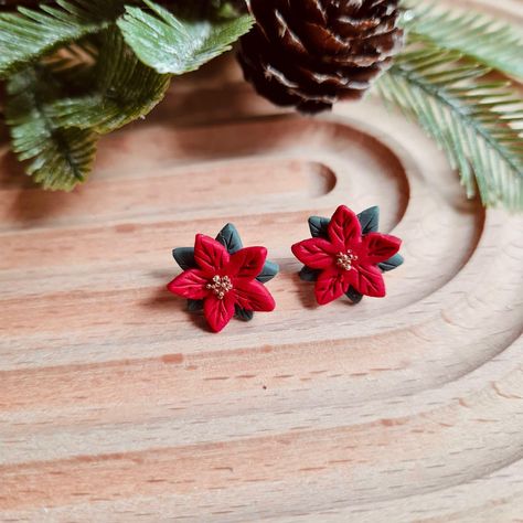 Poinsetta Christmas studs Handmade polymer clay earrings.  Made with hypoallergenic platinum accents. Christmas Earrings Polymer Clay, Polymer Clay Christmas Earrings, Clay Christmas Earrings, Christmas Clay Earrings, Poinsettia Earrings, Clay Stuff, Christmas Clay, Polymer Clay Christmas, Polymer Clay Jewelry Diy