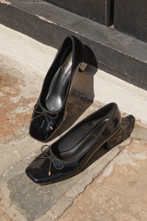 Keep things cute and simple with a classic look like the Lulus Marny Black Patent Low Heel Bow Ballet Pumps! Shiny faux patent leather shapes this season's trendiest silhouette that features a squared-toe upper with a low-cut collar and a delicate bow detail (with dainty gold aglets) that accents the vamp. The slip-on design of these timeless Mary Jane-style heels makes everyday styling oh-so easy, while a low block heel will keep you feeling comfortable! 1. 75" wrapped block heel. Lightly cushi Business Casual Mary Janes, 1.5 Inch Heels, 1 Inch Heels Shoes, Black Low Heels, Short Heel Shoes, Black Shoes For Women, Everyday Heels, Ballet Heels, Black Heels Low