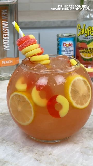 TIPSY BARTENDER 🍻🍹 on Instagram: "Crown Peach Fishbowl 🍑" Diy Fishbowl Drink, Applebees Shark Bowl Drink Copycat, Kids Fishbowl Drink, Fish Bowl Drink Recipe, Fishbowl Recipes, Fish Bowl Drink, Fishbowl Cocktail, Fishbowl Drink, Mocktail Ideas