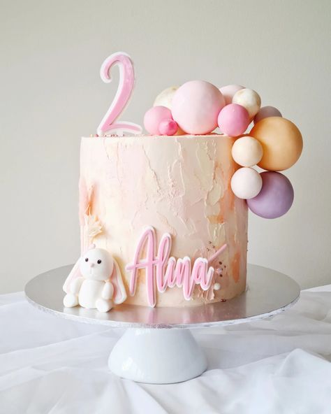 Alina's 2nd birthday cake - decorated with her favourite, a little bunny and balloons 🐰🎈 #bunnyjoy #birthdaybunny #cutefondantbunny #twoandadorable #watercolourcake #balloongarlands #2ndbirthday #2ndbirthdayparty #2ndbirthdaycake #cutebirthdaycake #sunshine #deerpark #derrimut #essendon #tullamarine #ascotvale #niddrie #keiloreast #keilor #mooneeponds #flemington #ravenhall #pointcookcakes #pointcook #sanctuarylakes 2nd Birthday Cake For Girl, 2tier Birthday Cake, 2nd Birthday Cake Ideas, 2nd Birthday Cake Girl, Girls 2nd Birthday Cake, Mama Cake, Second Birthday Cakes, 2nd Birthday Cake, Baby Birthday Decorations