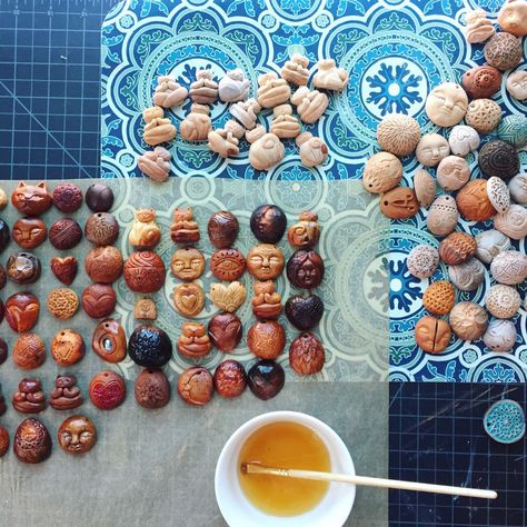 Applying oil to new avocado pit carvings 😍🥑🥑🥑 #avocado #avocadopit #artisanjewelry #handcrafted #jewelry #artisangifts #avocadopitnecklace #wip #carving #woodcarving Bone Engraving, Avocado Seed Carving, Avocado Jewelry, Sugar Scull, Avocado Pits, Avocado Pit, Avocado Art, Concept Art Inspiration, Avocado Seed