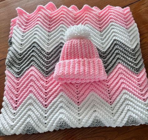 Crochet Ripple Baby Blanket This is Handmade and New. The colors of this Baby Blanket are Light Pink, Light Gray and White. The Ripple look of this Blanket is so cute. It comes with a Crochet Baby Hat in the color of Light Pink with a white pompom. The size of the Baby Hat fits 0-3 months, but it is stretchy so could wear longer. The size  of the Crochet Baby Blanket is 36 inches wide and 42 inches long. This Baby Blanket is made from 100 percent 4 ply Acrylic yarn How perfect this could be with Crochet Ripple Baby Blanket, Ripple Baby Blanket, Baby Crib Blanket, White Baby Blanket, Crochet Baby Blanket Free Pattern, Crocheting Projects, Crochet Idea, Crochet Blanket Designs, Baby Afghan