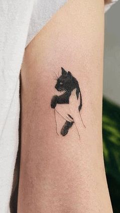 50 Rad Cat Tattoos To Immortalize Your Companion Three Legged Cat Tattoo, Black And White Cat Tattoo Ideas, Cat Tattoo On Arm, Black Kitten Tattoo, Black Cat Memorial Tattoo, Cat Tattoo Arm, Pet Cat Tattoo, Tattoo For Cat That Passed, Abstract Cat Tattoo