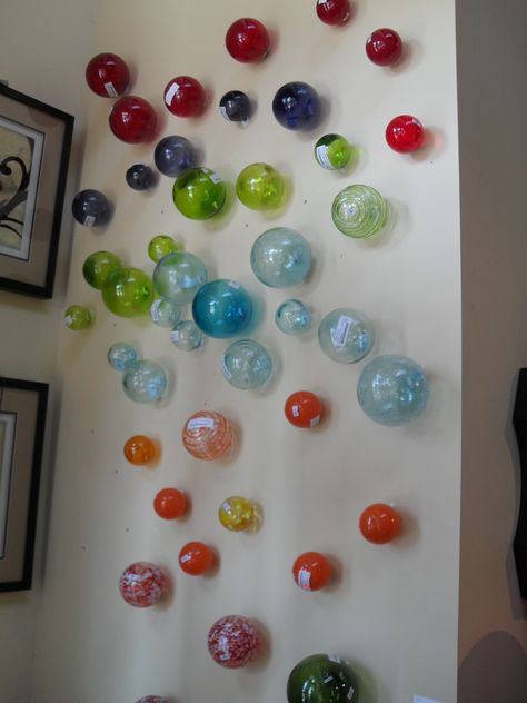 Great way for wall display! Hanging glass Spheres. Super cool! starting at $13.99. Glass Balls Display, Hanging Glass Globes, Wall Spheres, Blown Glass Wall Art, Gift Shop Displays, Bubbles Art, Hotel Christmas, Store Merchandise, Florida Interior Design