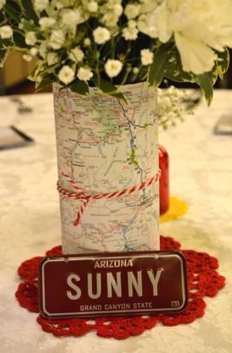 Map-Wrapped Centerpieces Hiking Themed Centerpieces, International Centerpiece Ideas, Around The World Theme Party Centerpieces Table Decorations, Missions Banquet Centerpieces, Map Centerpiece Ideas, Aviation Centerpieces, Around The World Table Centerpieces, Pilot Centerpieces, Road Trip Theme Party Decorations